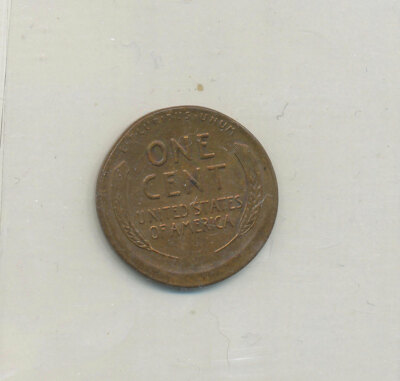 1944 wheat penny off-center strike error with Lincoln portrait displaced, blank planchet area visible, and full date retained